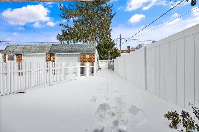 a view of a brick building next to a yard