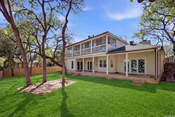a front view of a house with a yard table and chairs