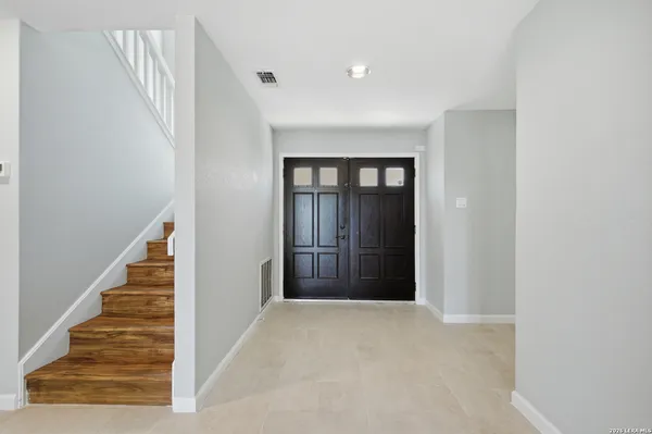 a view of a hallway with staircase