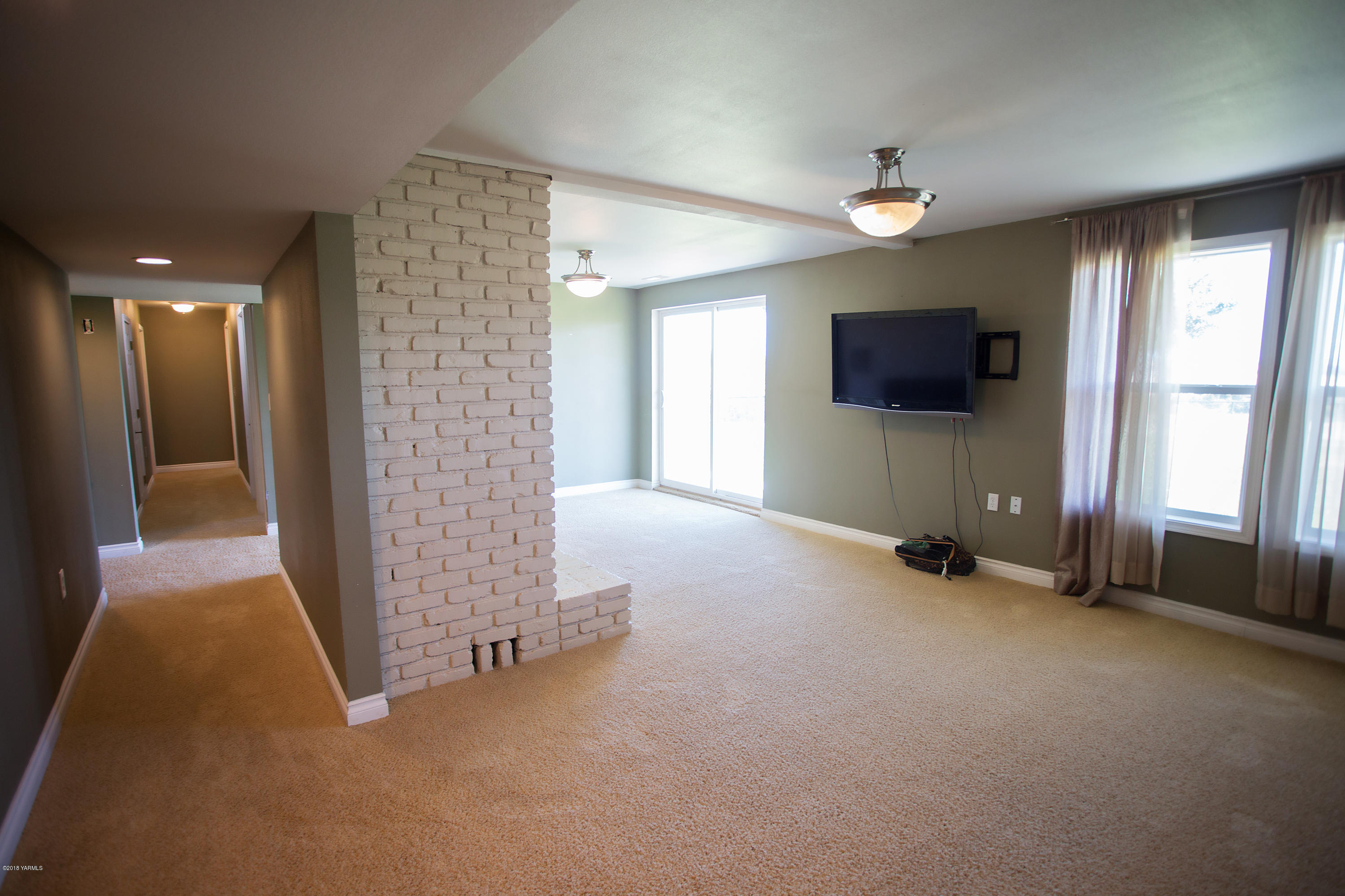 13077 Douglas Road Yakima, WA 98908 - Photo 22 of 35 a view of a livingroom with a flat screen tv