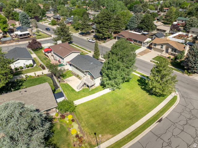2088 Falcon Way Sandy, UT 84093 - Photo 35 of 46 Large corner lot featuring a spacious green lawn and mature trees