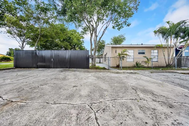 a house view with a sitting space and garden