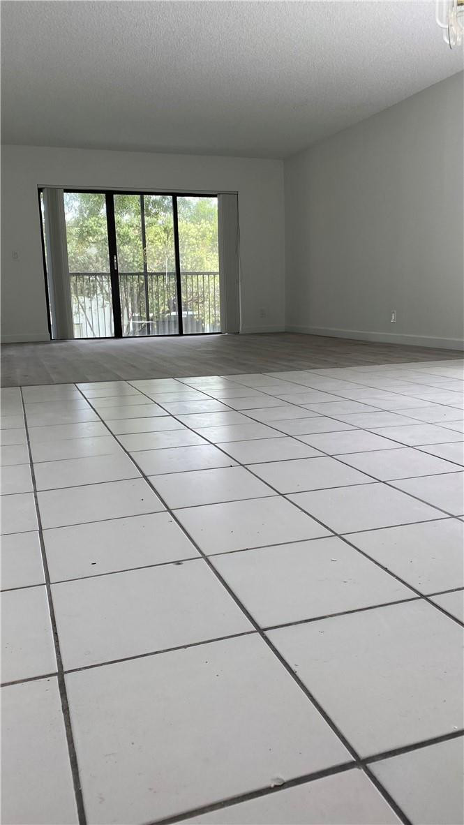 340 Racquet Club Road, Unit 204 Weston, FL 33326 - Photo 5 of 15 an empty room with windows