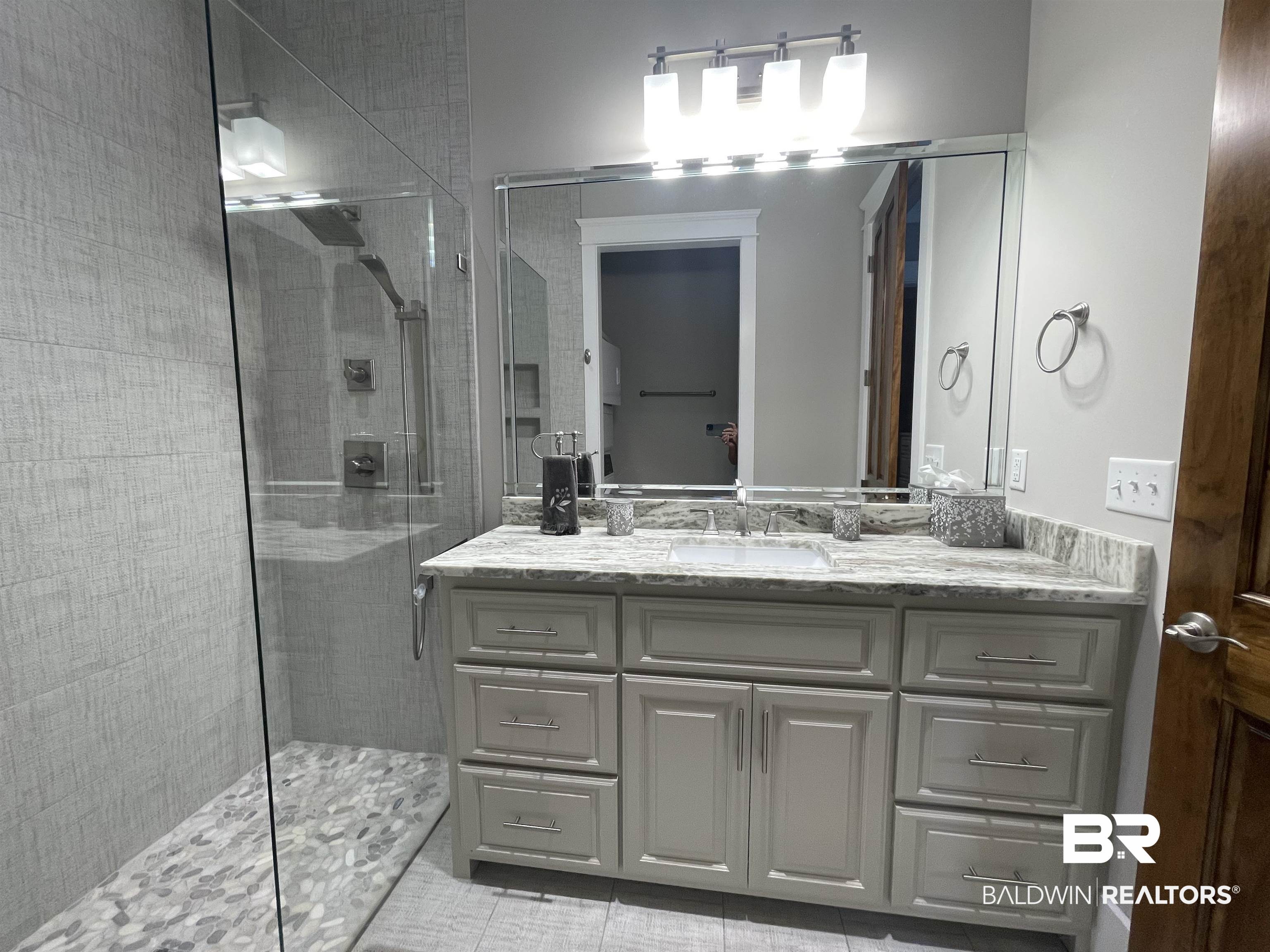 6 Fairhope Motorcoach Loop Fairhope, AL 36532 - Photo 12 of 33 Bathroom with tile patterned flooring, a tile shower, and vanity