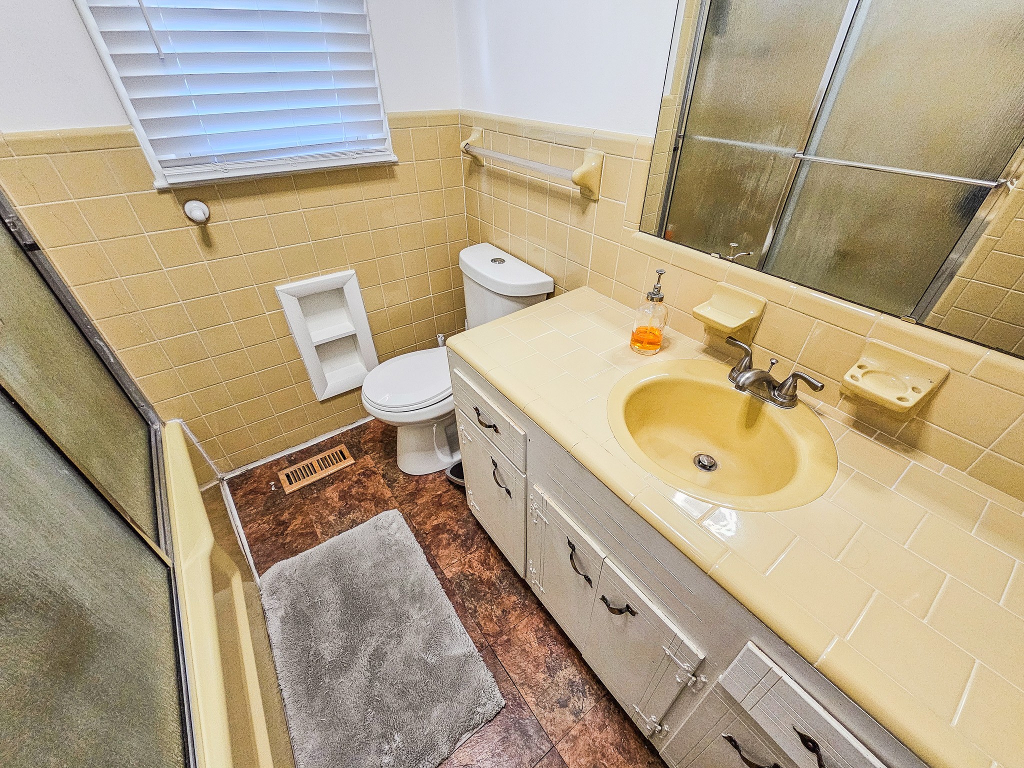 300 Longview Drive Pulaski, TN 38478 - Photo 17 of 35 a bathroom with a sink and mirror with toilet