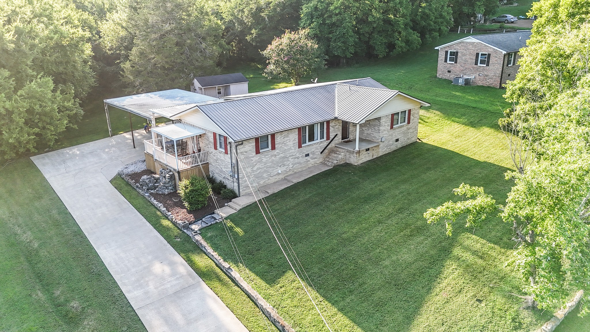300 Longview Drive Pulaski, TN 38478 - Photo 3 of 35 a view of a house with a big yard and large trees