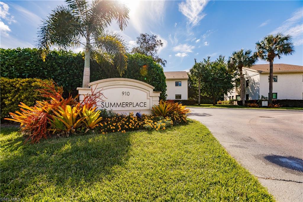910 Vanderbilt Beach Road, Unit 311W Naples, FL 34108 - Photo 1 of 31 a front view of a house with a garden