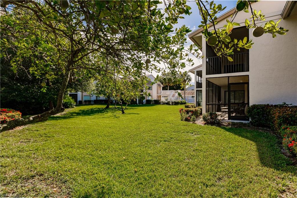 910 Vanderbilt Beach Road, Unit 311W Naples, FL 34108 - Photo 31 of 31 a view of a house with backyard and sitting area