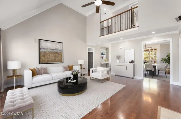 a living room with furniture or couch and a wooden floor