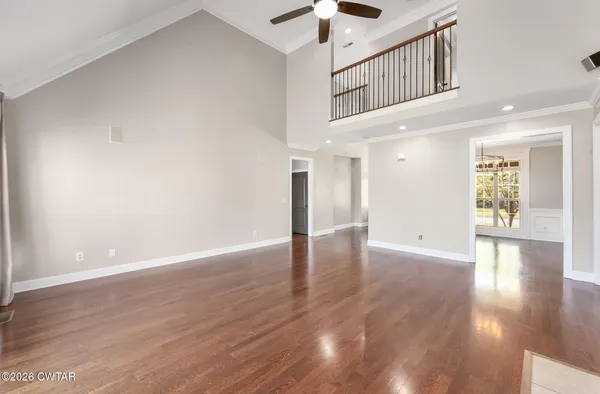 a view of an entryway with wooden floor
