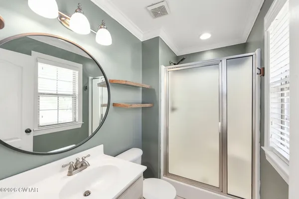 an aerial view of a house with a garden