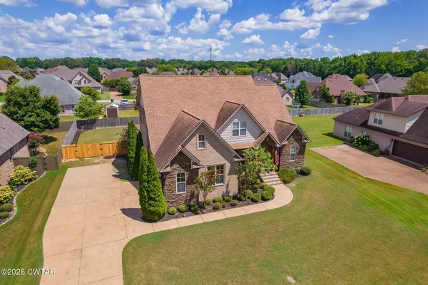 an aerial view of a house with a garden