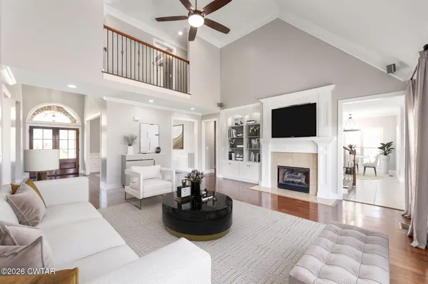 a living room with furniture and a fireplace