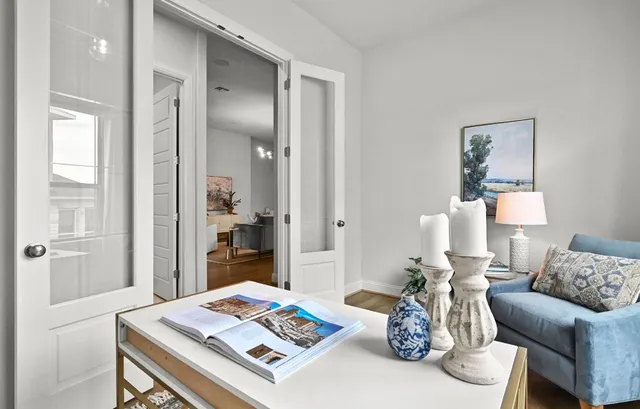 a living room with furniture and next to a window
