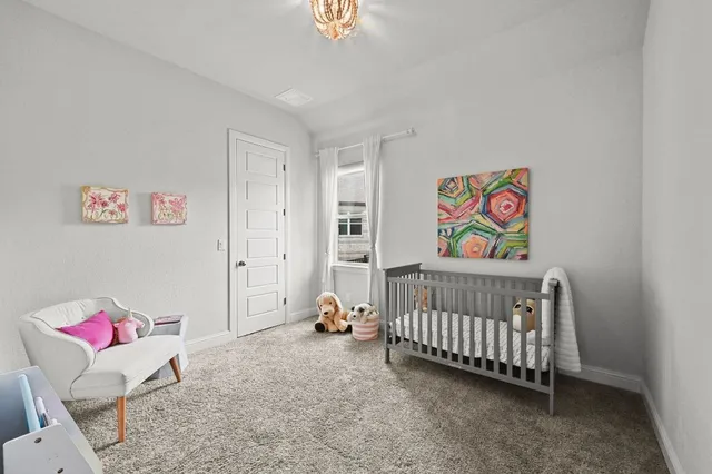 a bedroom with furniture and a bed