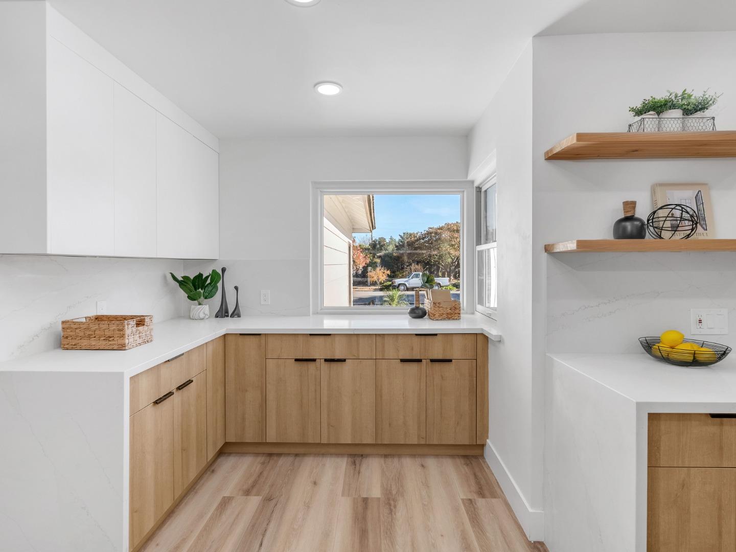 2303 Gunar Drive San Jose, CA 95124 - Photo 12 of 42 a kitchen with a sink and cabinets