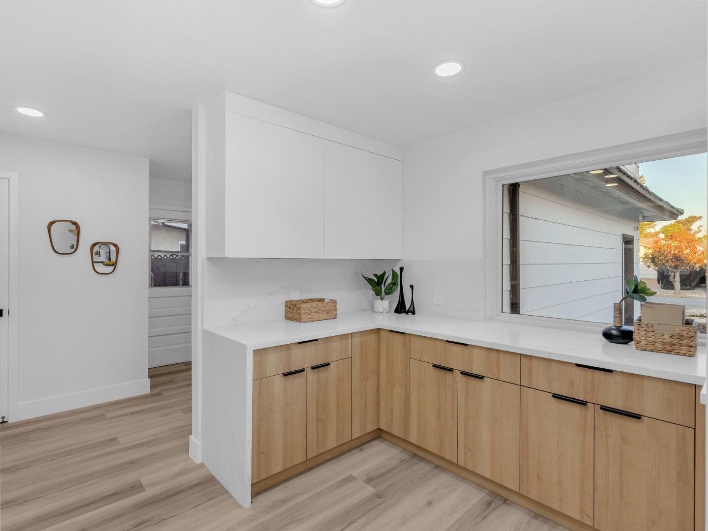 2303 Gunar Drive San Jose, CA 95124 - Photo 13 of 42 a kitchen with a sink cabinets and wooden floor