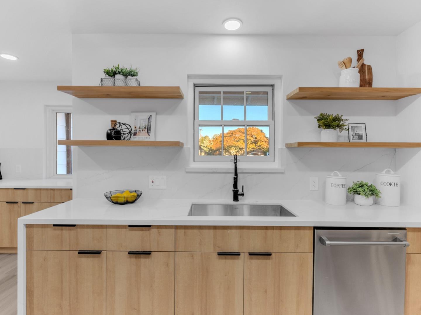 2303 Gunar Drive San Jose, CA 95124 - Photo 14 of 42 a kitchen with a sink and a wooden cabinets