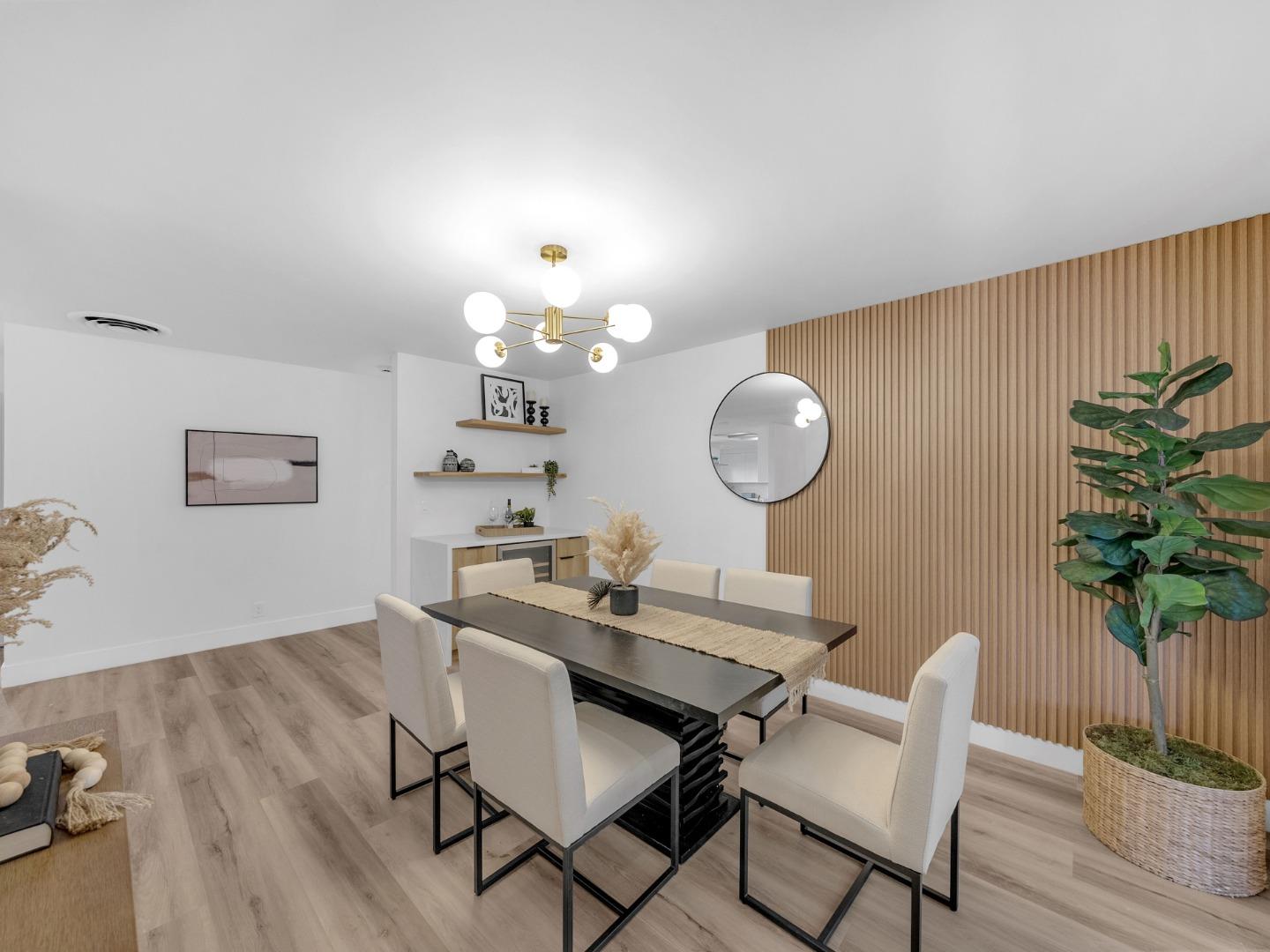2303 Gunar Drive San Jose, CA 95124 - Photo 15 of 42 a view of a dining room with furniture and wooden floor