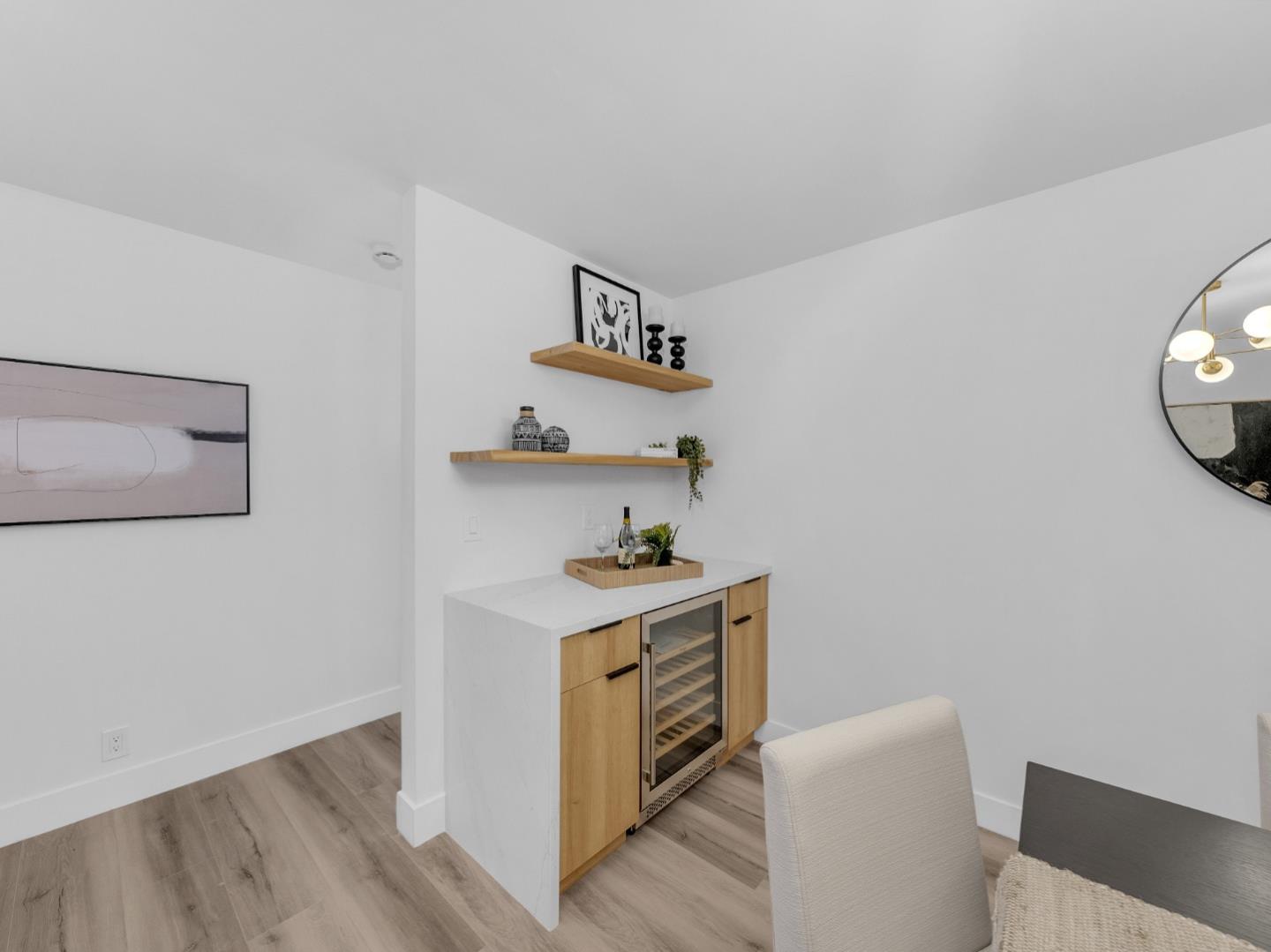 2303 Gunar Drive San Jose, CA 95124 - Photo 16 of 42 a kitchen with a stove and wooden floor