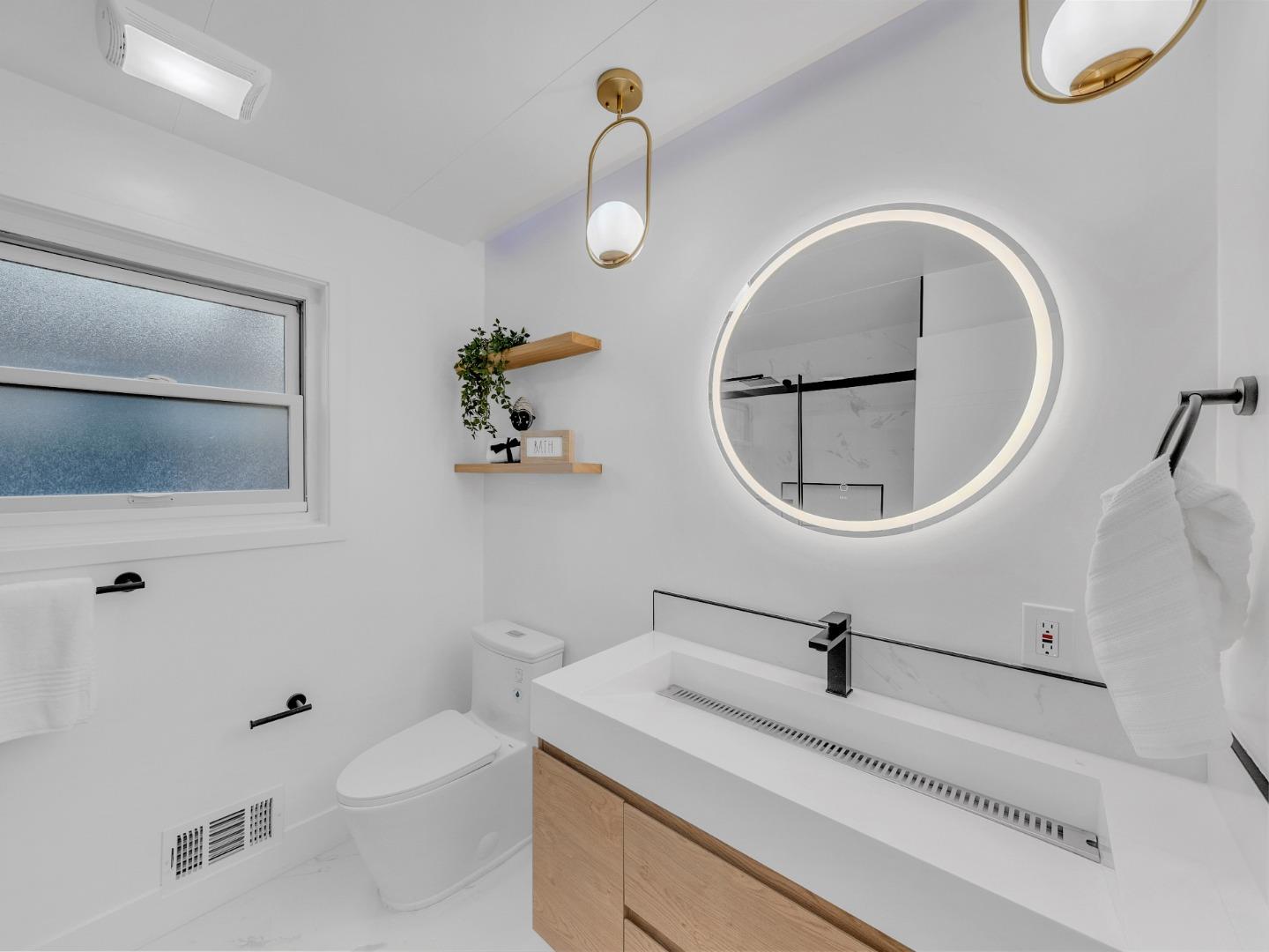 2303 Gunar Drive San Jose, CA 95124 - Photo 17 of 42 a bathroom with a sink a toilet and a mirror