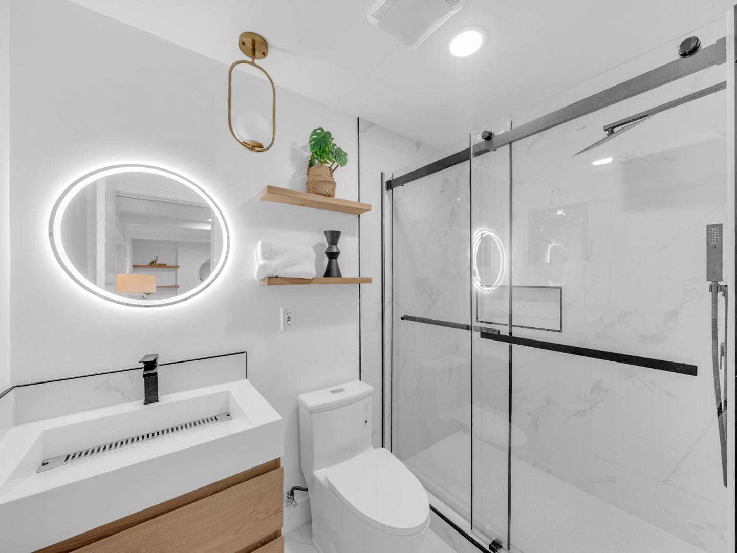 2303 Gunar Drive San Jose, CA 95124 - Photo 18 of 42 a bathroom with a sink toilet and a mirror