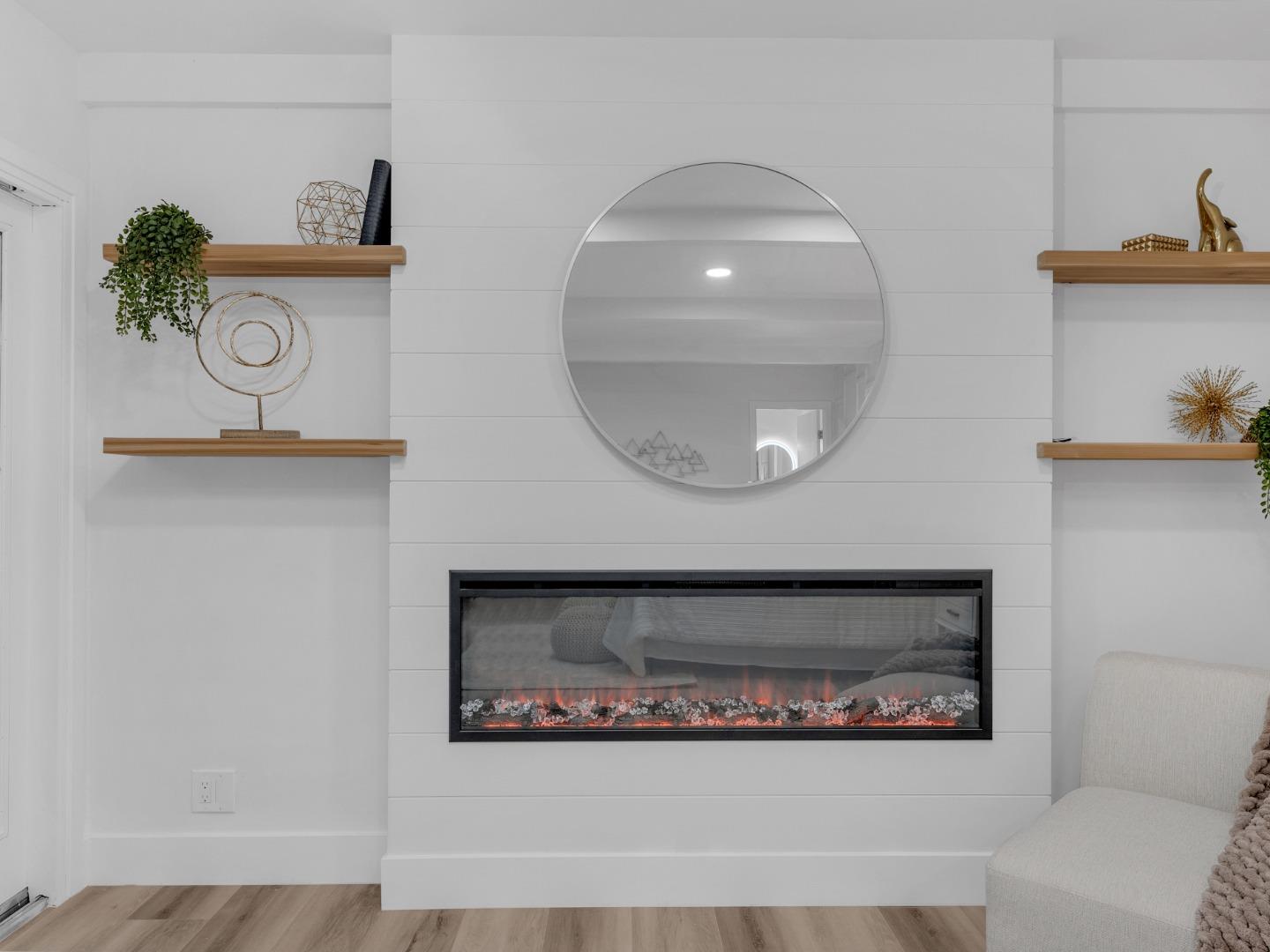 2303 Gunar Drive San Jose, CA 95124 - Photo 20 of 42 a front view of a fireplace with two painting on the wall