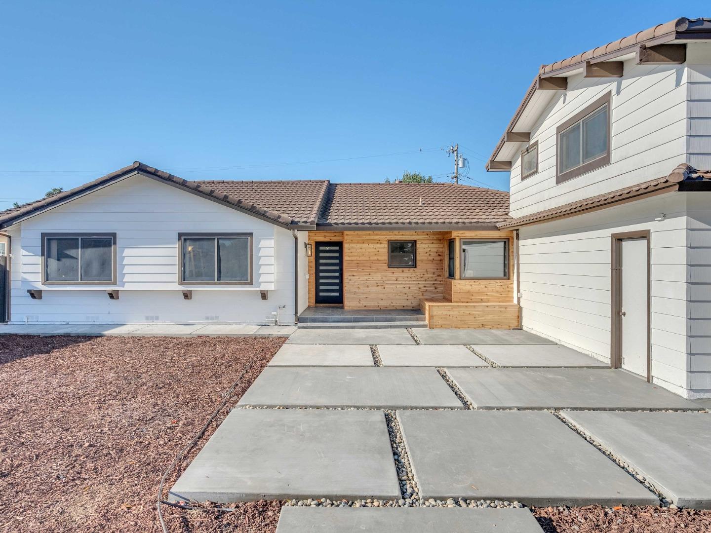 2303 Gunar Drive San Jose, CA 95124 - Photo 2 of 42 a front view of a house with a yard
