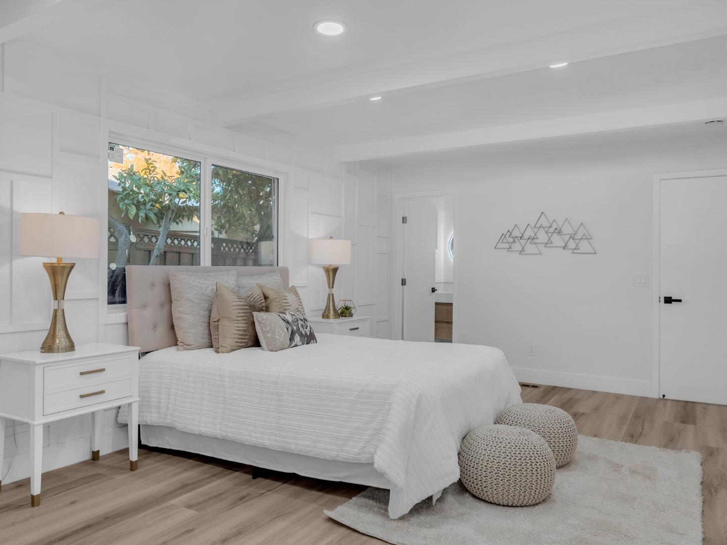 2303 Gunar Drive San Jose, CA 95124 - Photo 23 of 42 a bedroom with a bed and a large window