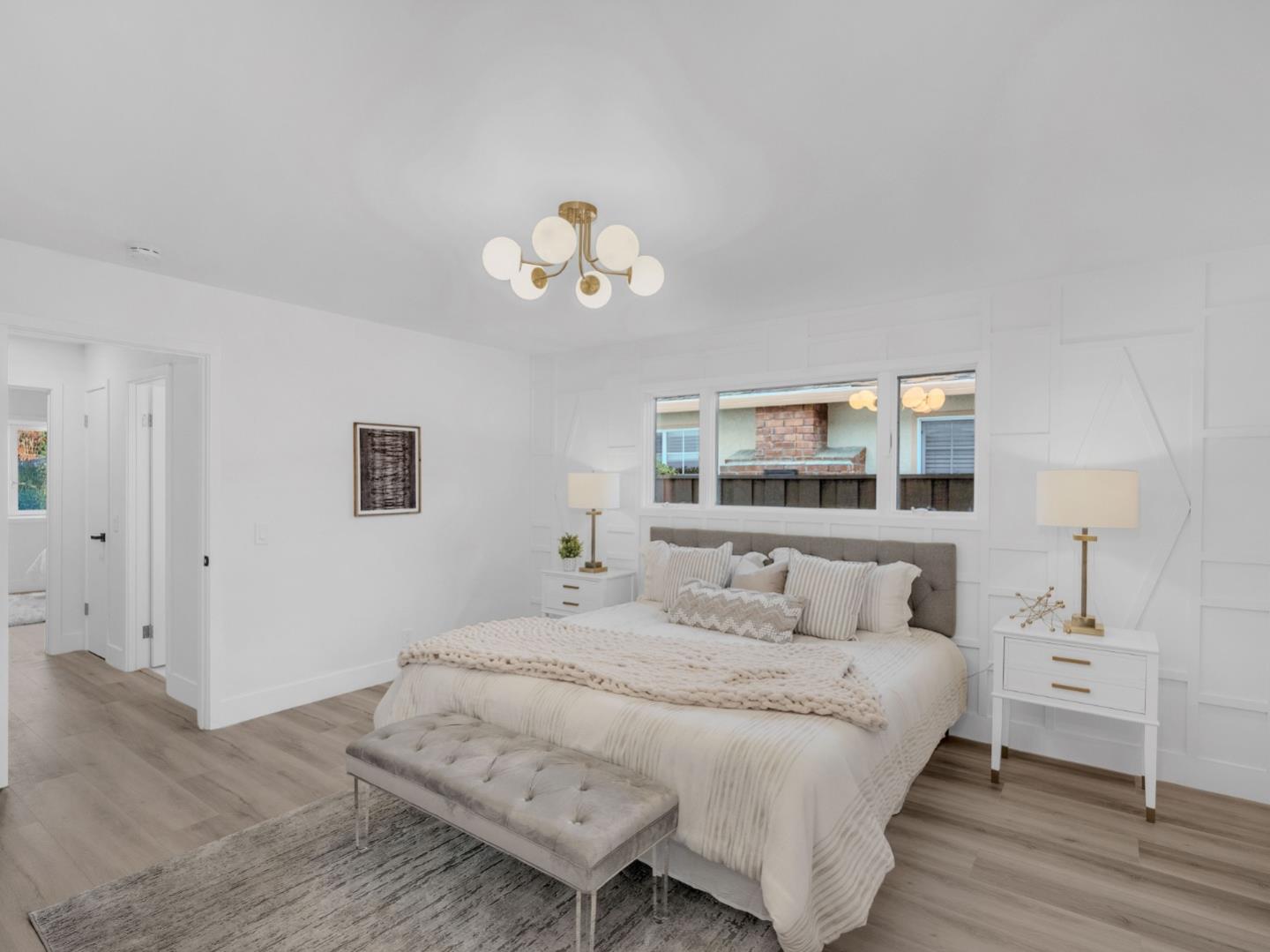 2303 Gunar Drive San Jose, CA 95124 - Photo 26 of 42 a bedroom with a bed and a chandelier