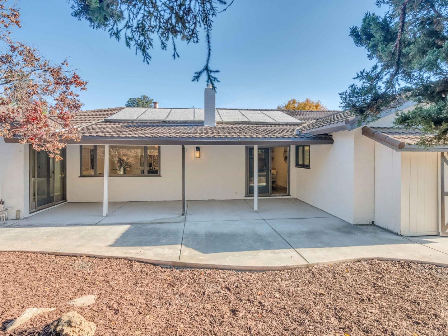 2303 Gunar Drive San Jose, CA 95124 - Photo 32 of 42 a front view of a house with a yard and garage