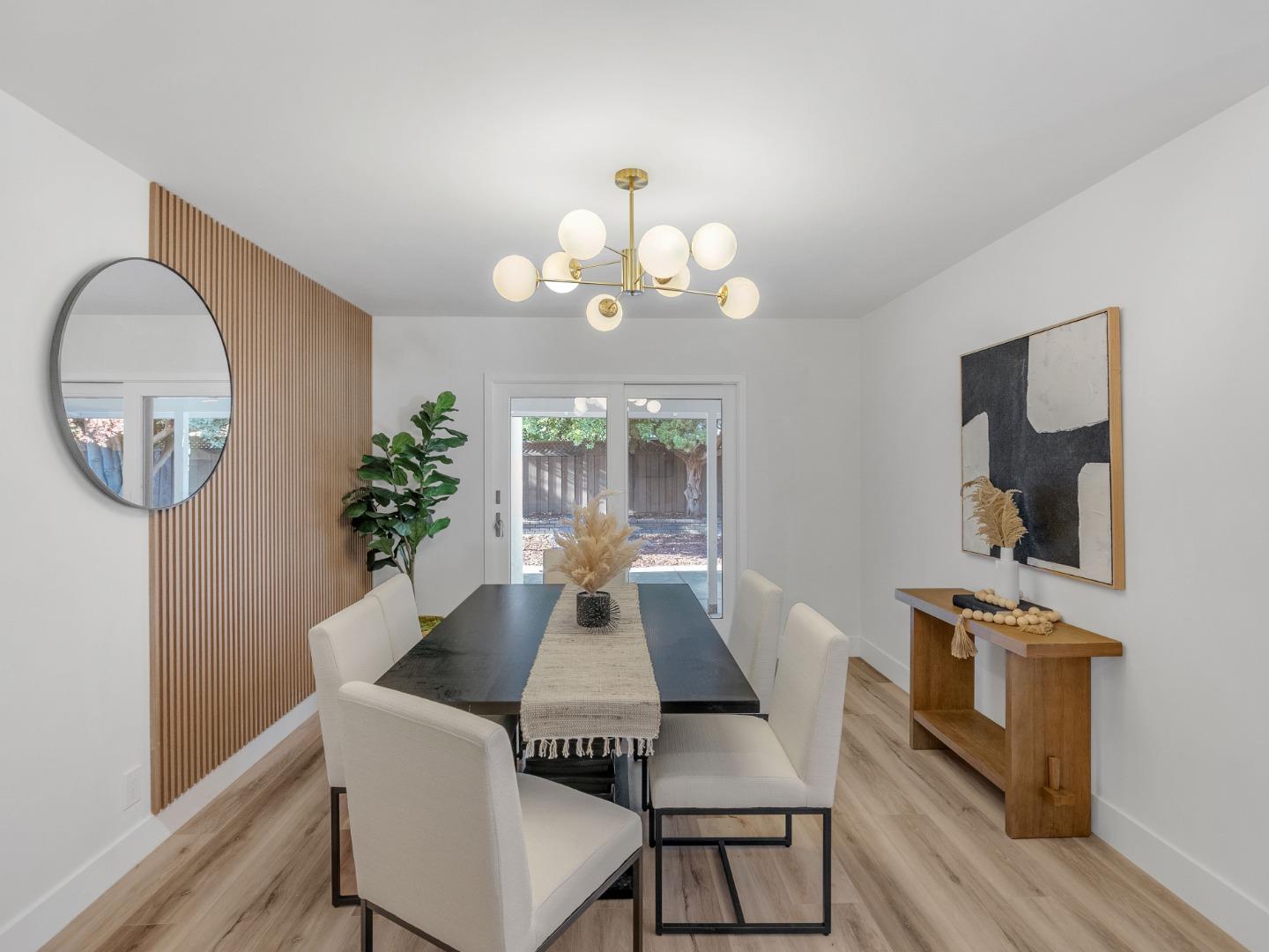 2303 Gunar Drive San Jose, CA 95124 - Photo 36 of 42 a view of a dining room with furniture a potted plant and wooden floor