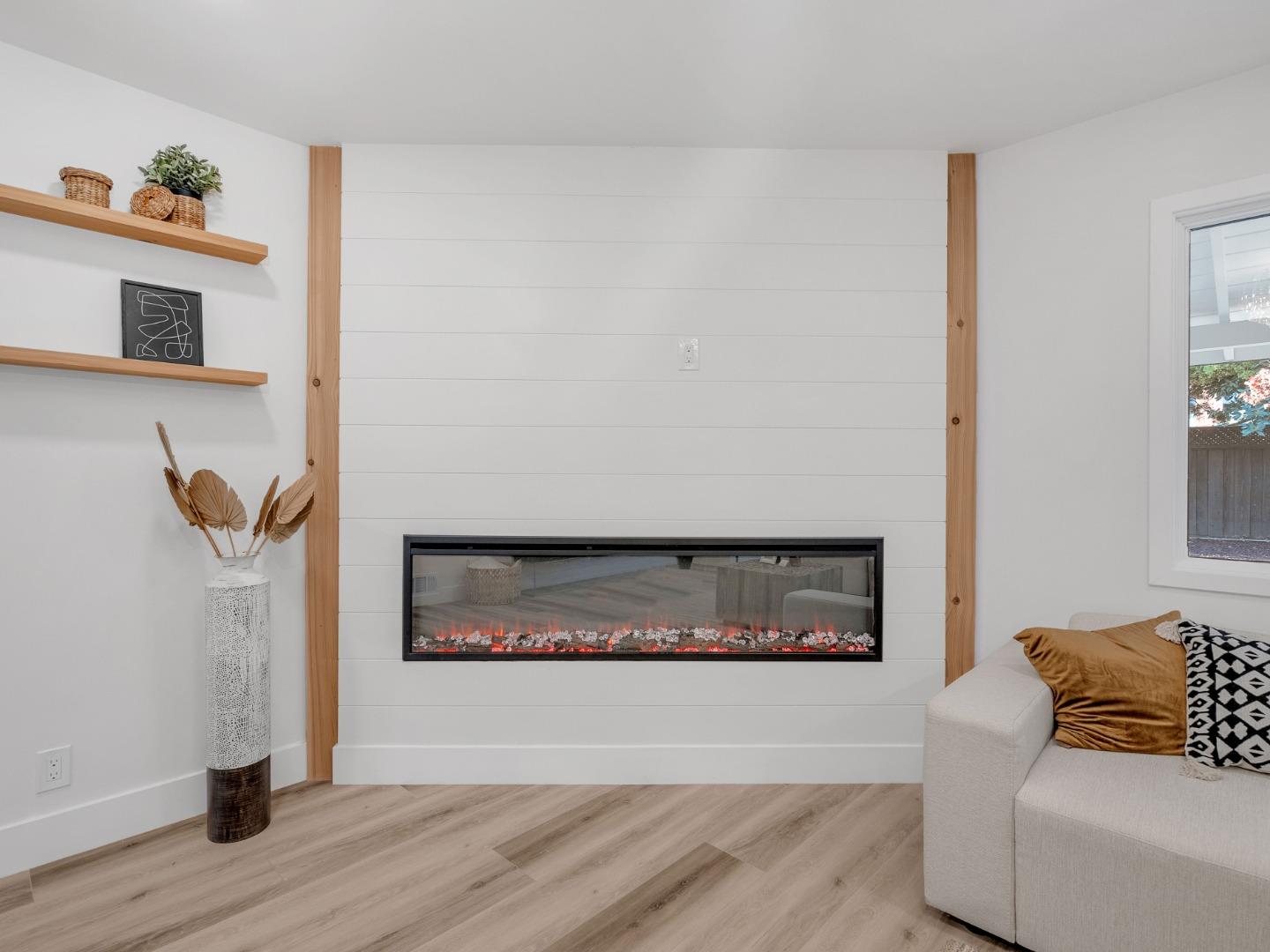 2303 Gunar Drive San Jose, CA 95124 - Photo 6 of 42 a living room with furniture and a fireplace
