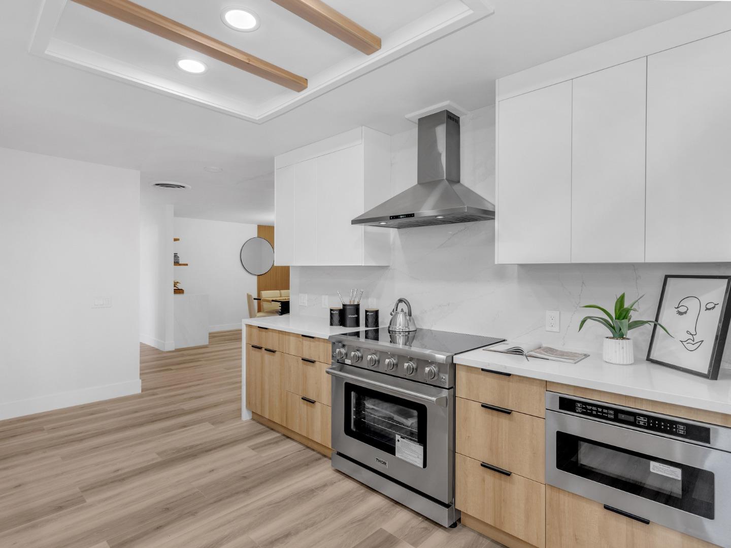 2303 Gunar Drive San Jose, CA 95124 - Photo 7 of 42 a kitchen with stainless steel appliances granite countertop a stove and a sink