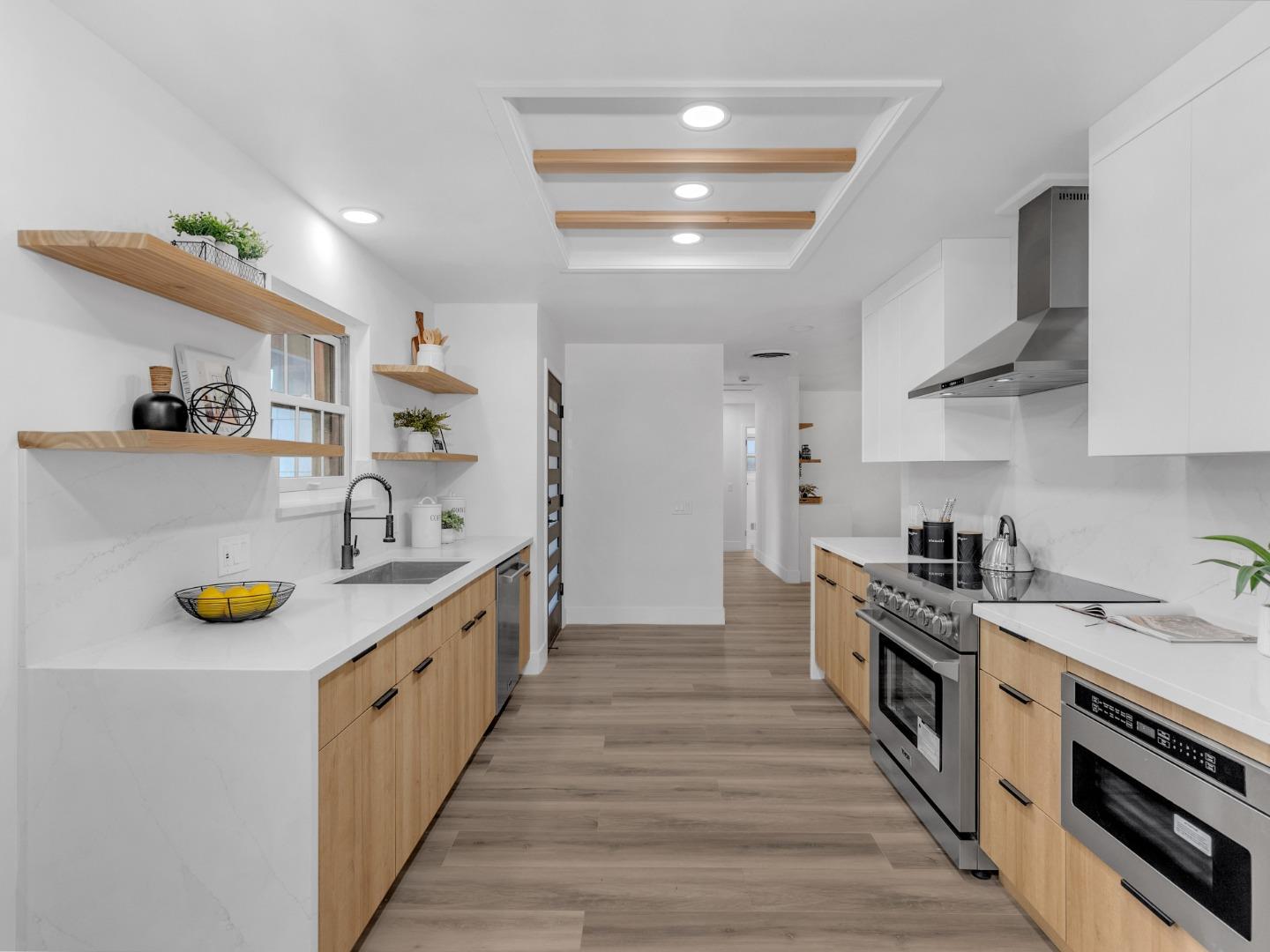2303 Gunar Drive San Jose, CA 95124 - Photo 10 of 42 a kitchen with stainless steel appliances a sink stove and cabinets