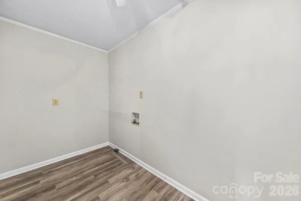 a view of a small space with wooden floor