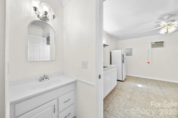 a bathroom with a double vanity sink a mirror and a shower