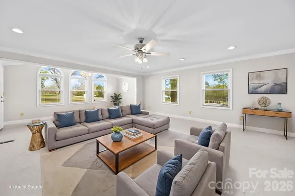 a living room with furniture and a window