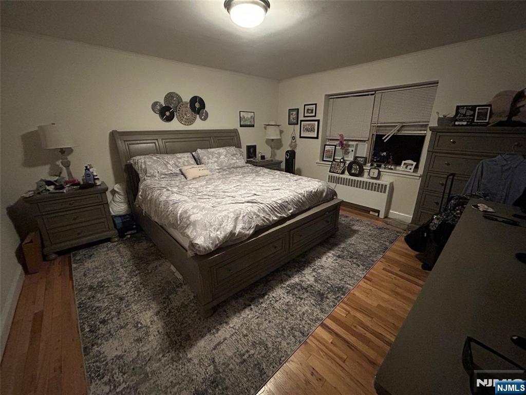 280-320 Oak Street, Unit 280A Ridgewood, NJ 07450 - Photo 10 of 24 a bed room with a bed and a night stand