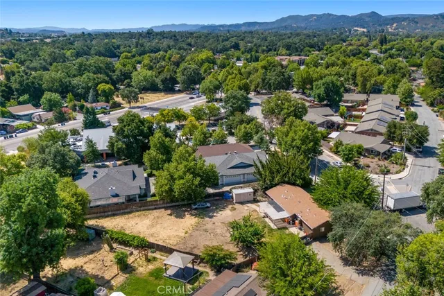 an aerial view of a house with a garden