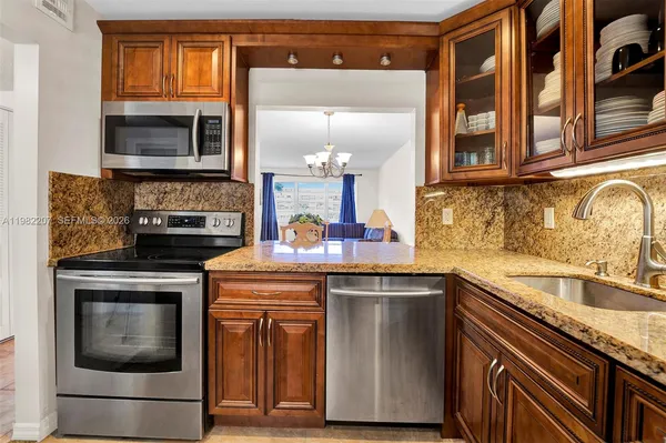 a kitchen with a sink and a microwave