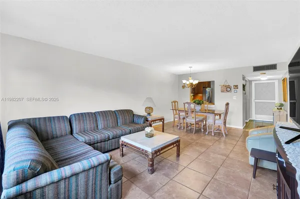 a living room with furniture and a table