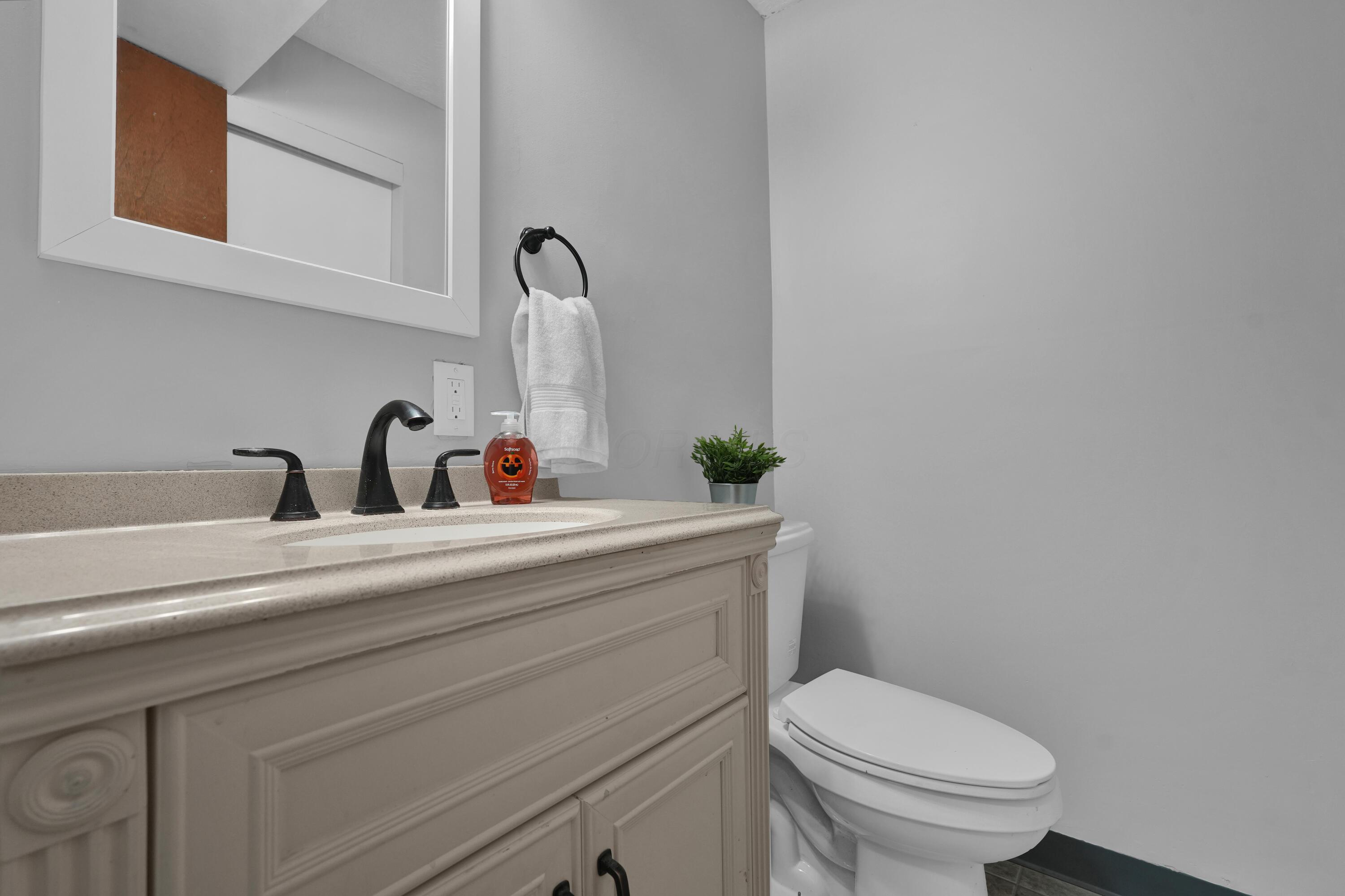 208 Cumberland Road Delaware, OH 43015 - Photo 25 of 37 Lower Level powder room has updated paint paint and vanity!