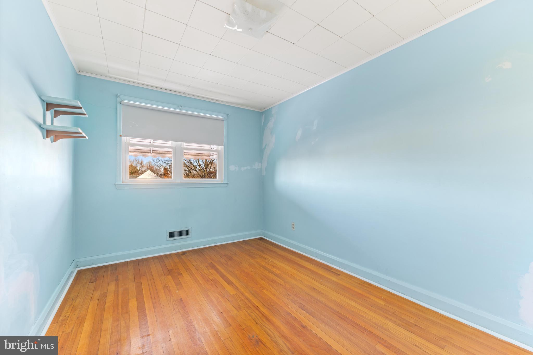 2245 Searles Road Baltimore, MD 21222 - Photo 20 of 33 a view of empty room with wooden floor