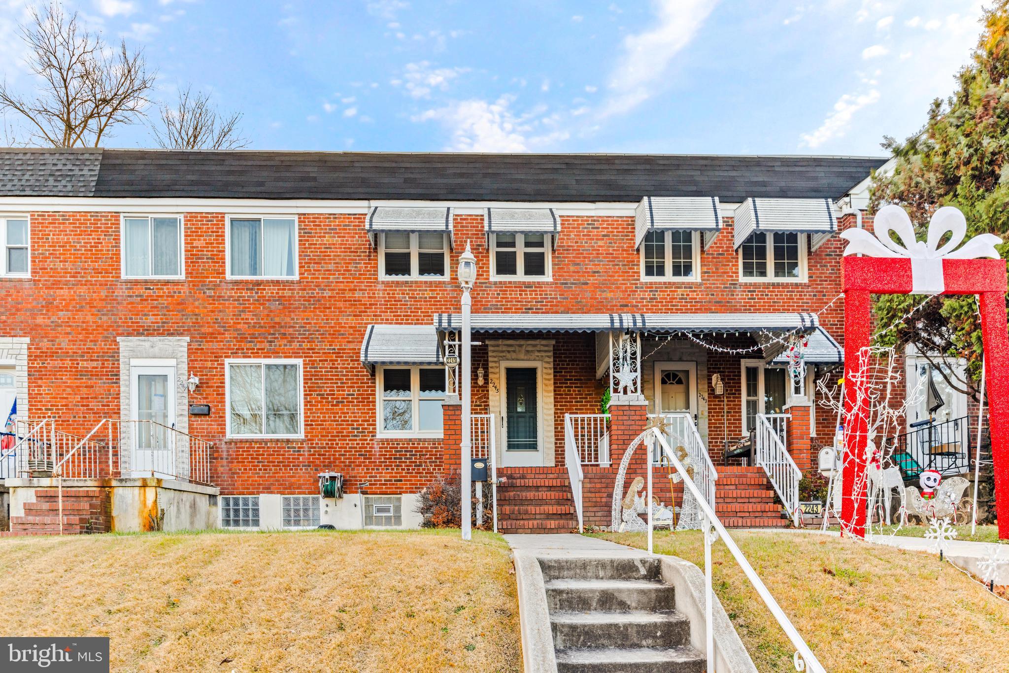 2245 Searles Road Baltimore, MD 21222 - Photo 2 of 33 a front view of a house with a yard