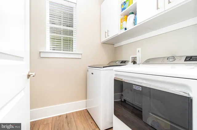 a view of a patio with a dining table and chairs with a fire pit