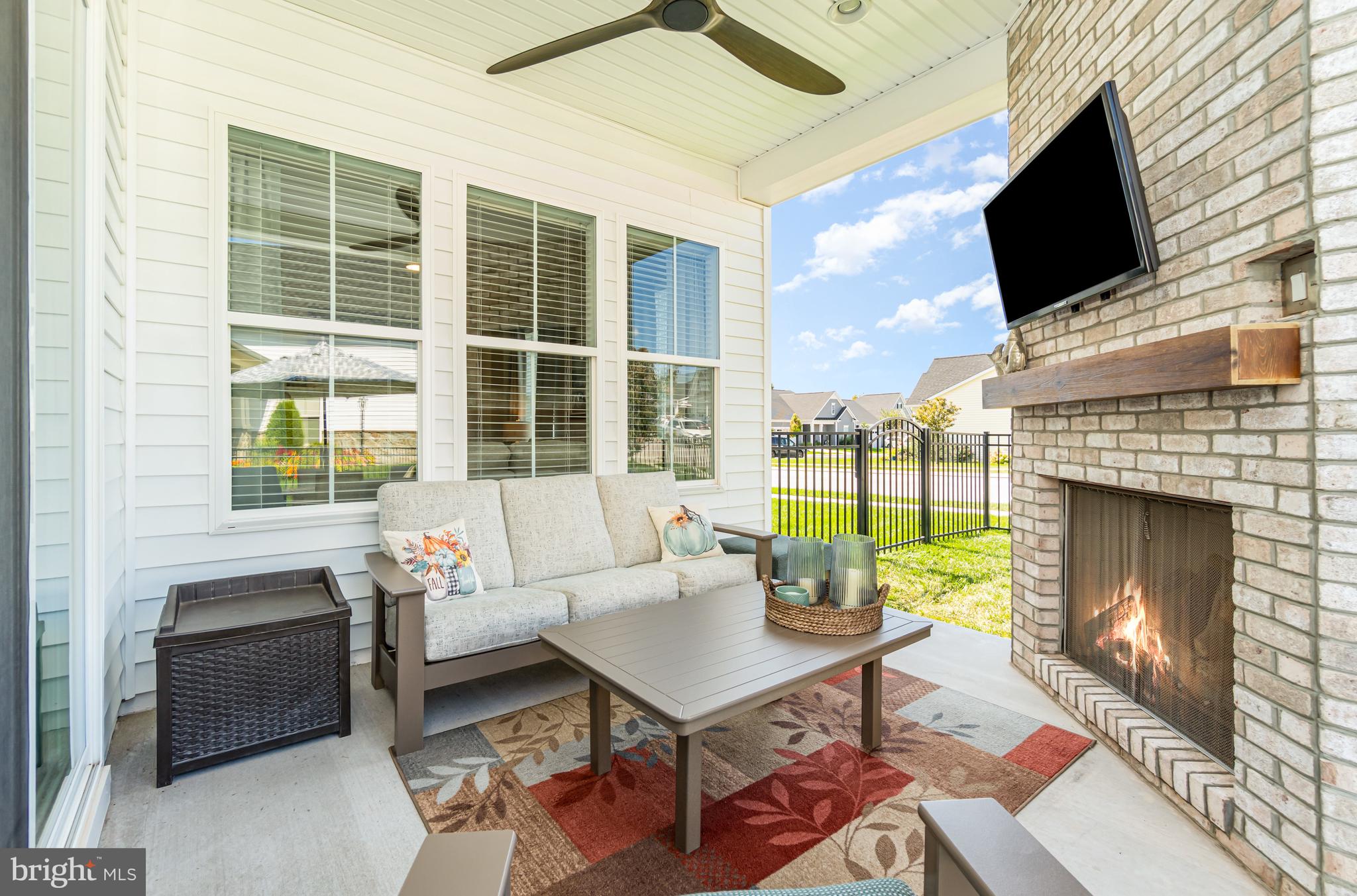 173 Lively Stream Way Gettysburg, PA 17325 - Photo 28 of 59 a living room with furniture a fireplace and a flat screen tv