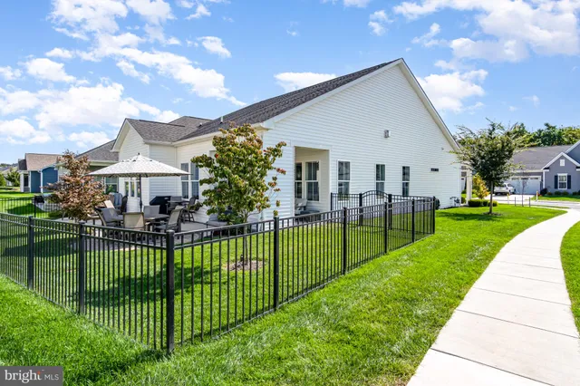 a dinning room with furniture and wooden floor