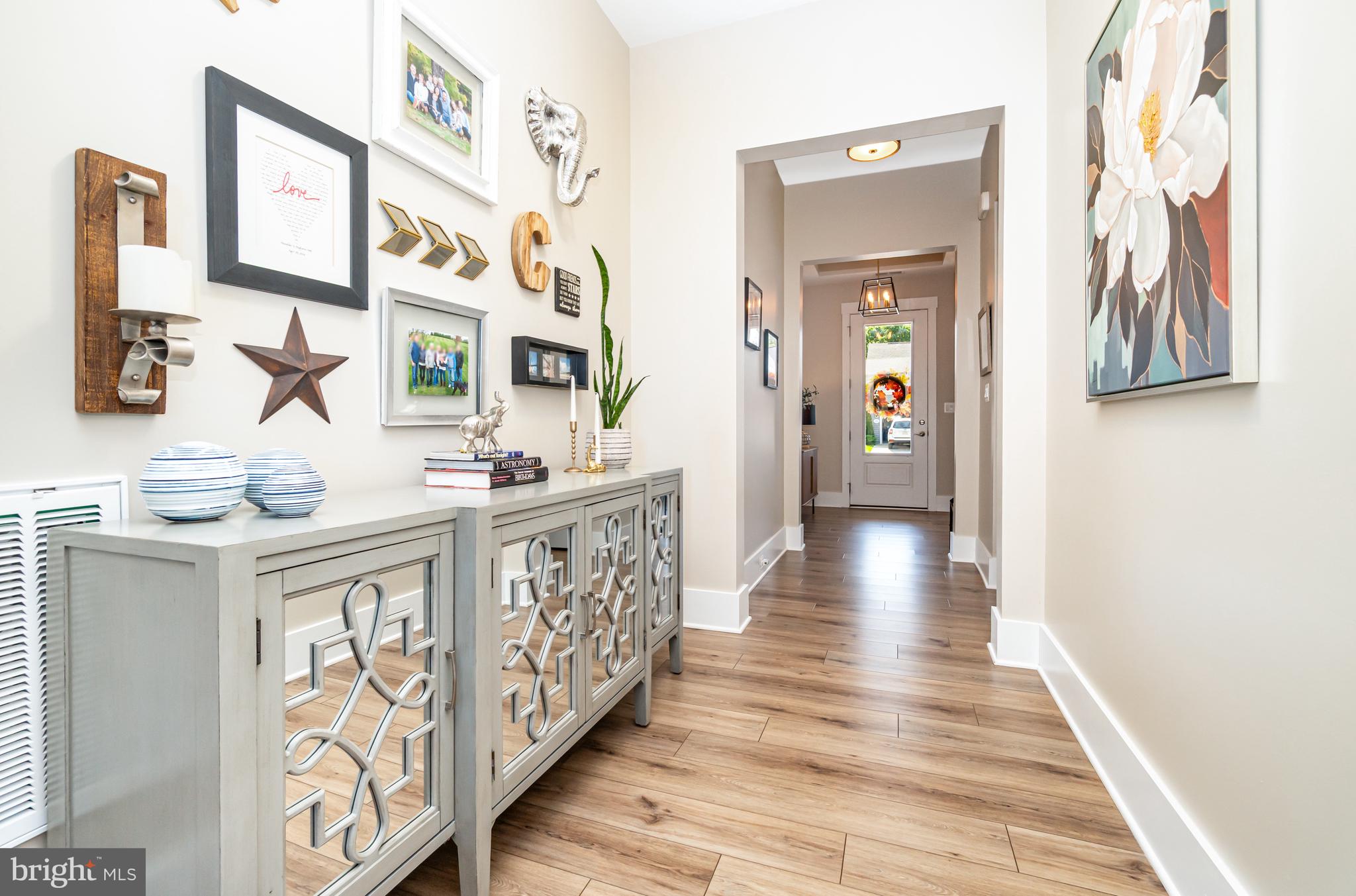 173 Lively Stream Way Gettysburg, PA 17325 - Photo 8 of 59 a view of a hallway with wooden floor and windows