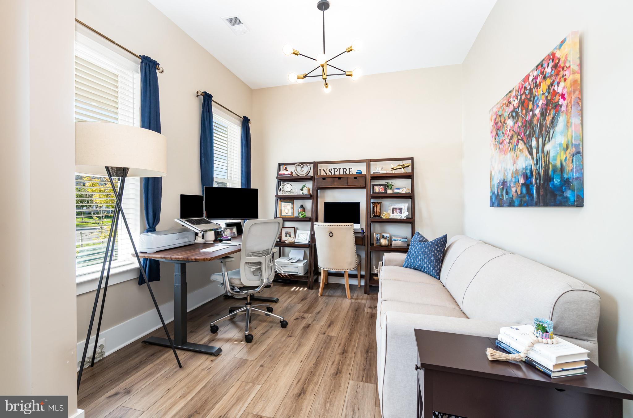 173 Lively Stream Way Gettysburg, PA 17325 - Photo 9 of 59 a view of a workspace with furniture and a potted plant